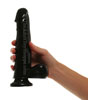 Black Dildo held by hand