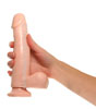 White Dildo being held